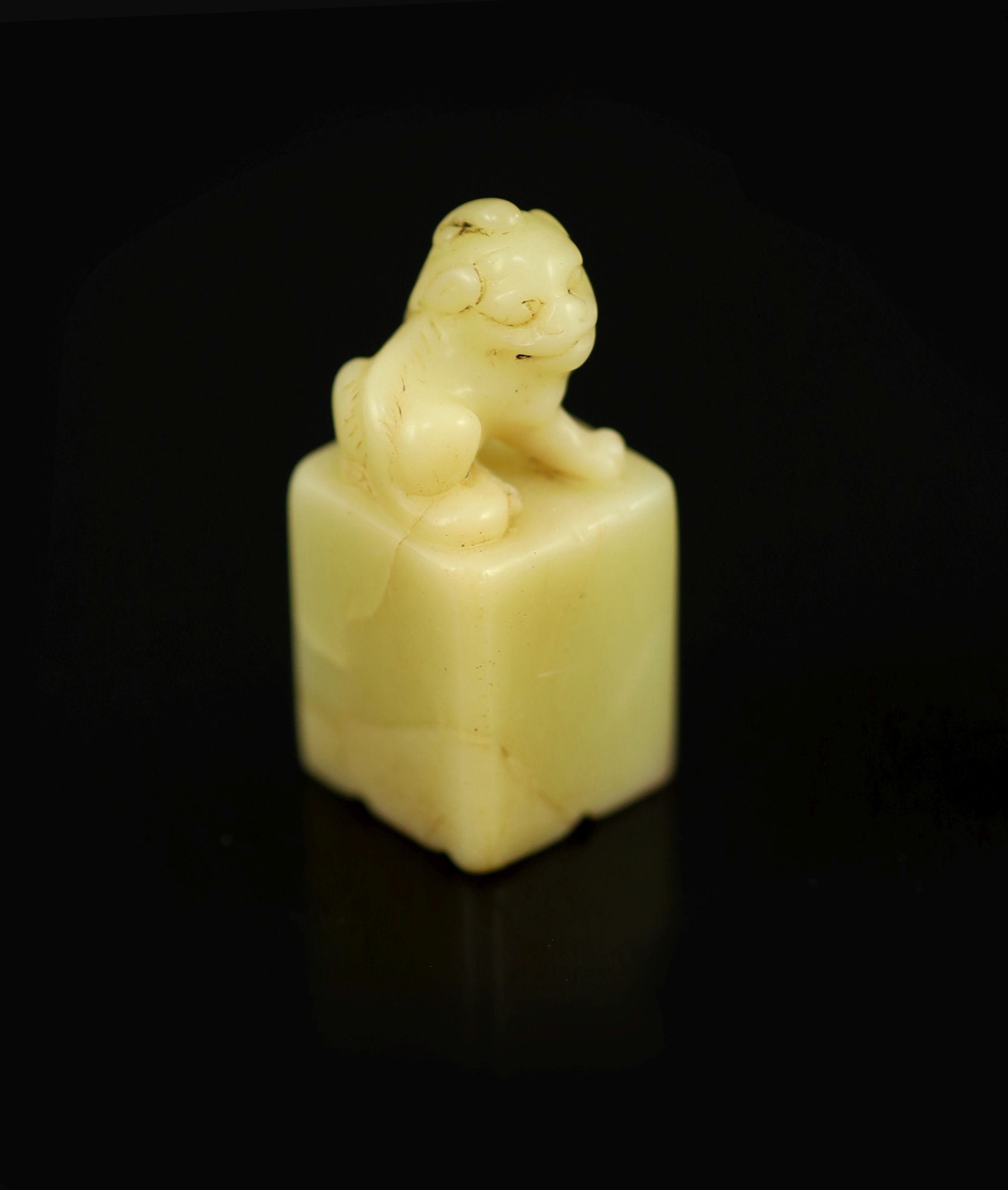 A Chinese inscribed cream coloured soapstone seal, 3.9 cm high